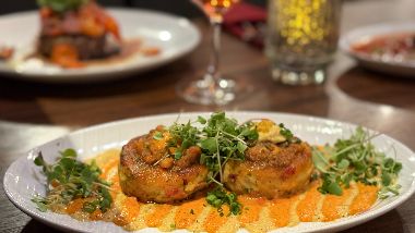 1853 Bistro & Bar Crab Cakes on a plate with garnish