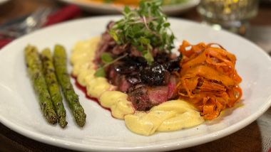1853 Bistro & Bar steak, mashed potatoes, asparagus and carrots on a plate