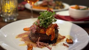 1853 Bistro & Bar Steak on a place with garnish