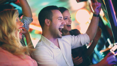 group of friends winning at slots