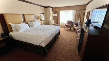 Hotel room bed, TV and whirlpool tub