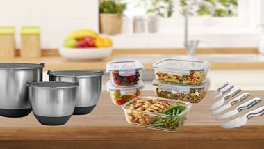 Mixing bowls, knives & food storage containers on a counter.