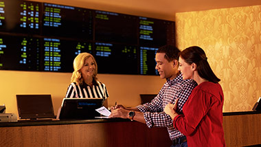 People placing bets at Sportsbook