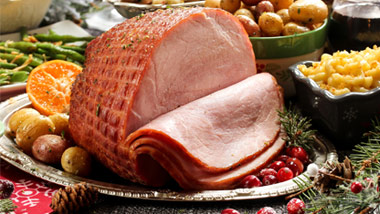 holiday ham with potatoes, mac & cheese, oranges, green beans and cranberries