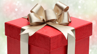 red gift with gold bow