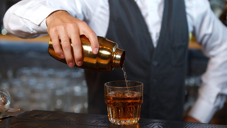 bartender pouring a drink